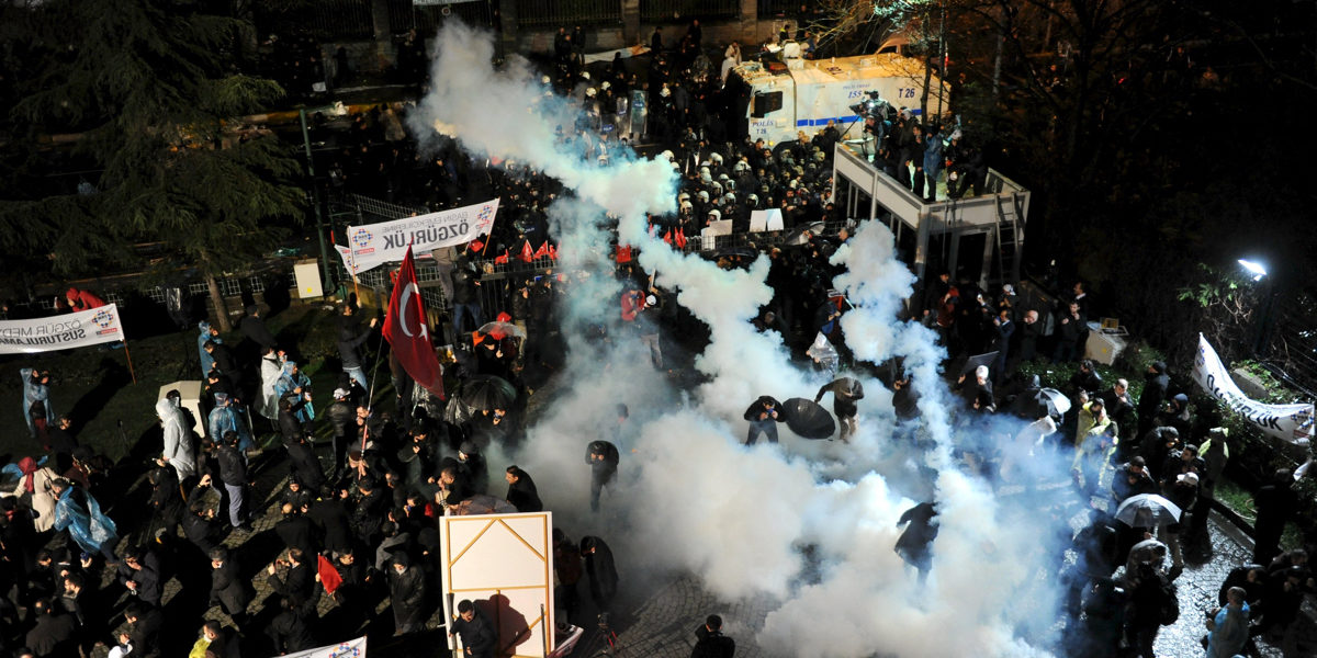 Riot police use tear gas to disperse protesting employees and supporters of Zaman newspaper  in Istanbul