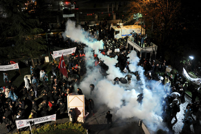Riot police use tear gas to disperse protesting employees and supporters of Zaman newspaper  in Istanbul