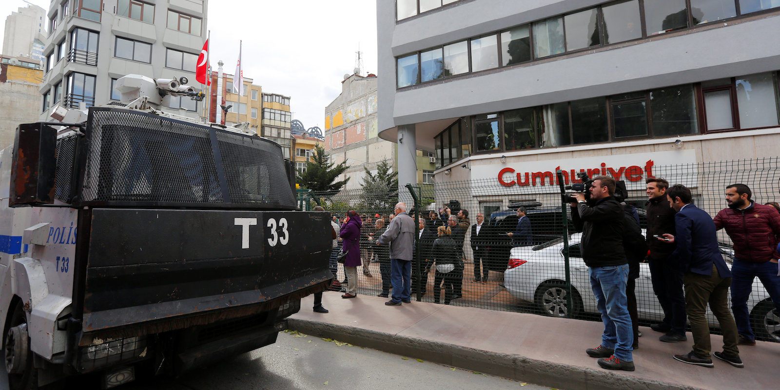 An armored police vehicle drives past by the headquarters of Cumhuriyet newspaper, an opposition secularist daily, in Istanbul